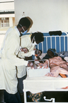 Free Picture of Doctors Giving Health Care to a Female Lassa Fever Patient in the Segbwema, Sierra Leone Clinic