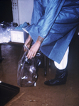 Free Picture of Doctor Putting On Plastic Boot Covers