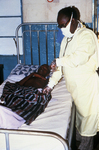 Free Picture of Doctor Examining a Lassa Fever Patient in the Segbwema, Sierra Leone Clinic - 1977