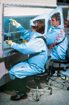 Free Picture of Laboratorians Working Under a Flow Hood Inside a BSL-4 (Bio Safety Lab) Laboratory