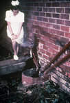 Free Picture of Nurse Standing Near Sewage Pipes Outside of an Infectious Disease Hospital in Johannesburg, South Africa