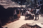 Free Picture of Person Issuing Ration Cards to African People in Port Harcourt, Nigeria During the Nigerian-Biafran War