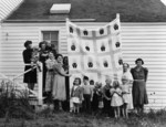 People Holding a Quilt