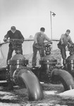 Men Operating Oil Valves