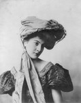 Woman With Cloth and Hat on Head