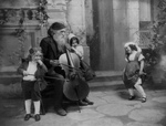 Man Playing Cello, Child Playing Violin, Children Dancing