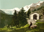 Man Seated Near a Chapel in the Swiss Alps