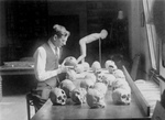 William H. Egberts Studying Skulls